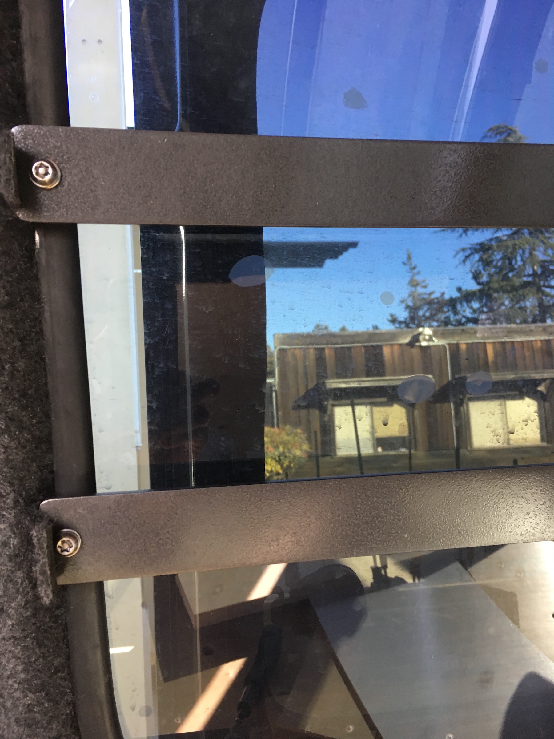 Custom made brackets and security bars for Delica L300 windows.