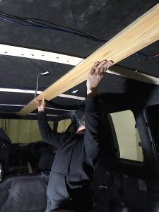 Dry fitting the ceiling pieces to mark where the stringers are and to put holes in for the lights. Wood ceiling installation for Mitsubishi Delica L300